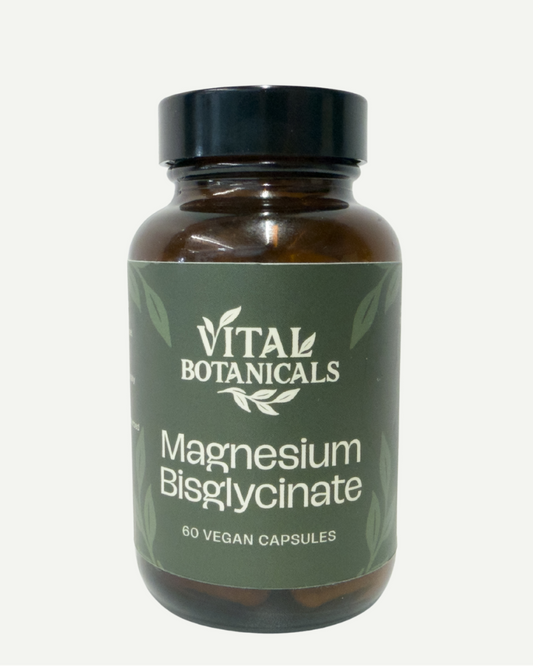 Vial of Vital Botanicals Magnesium Bisglycinate capsules on a white background